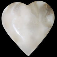Mangano Calcite hand-carved heart 73*78*20mm 160g in sunlight - Rocks and Things Store