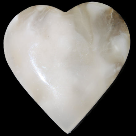 Mangano Calcite hand-carved heart 73*78*20mm 160g in sunlight - Rocks and Things Store