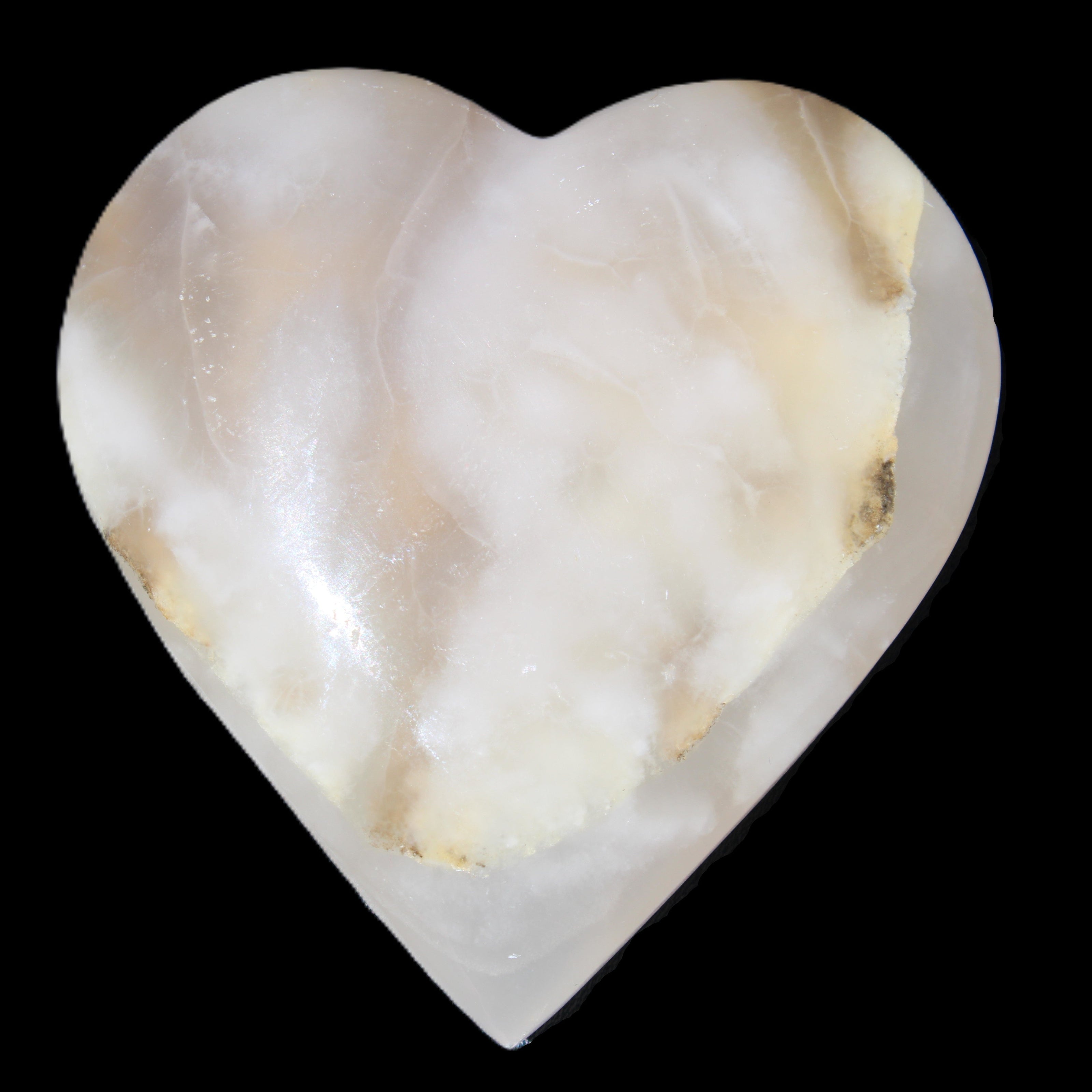 Mangano Calcite hand-carved heart 73*78*20mm 160g in sunlight - Rocks and Things Store