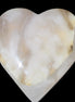 Mangano Calcite hand-carved heart 73*78*20mm 160g in sunlight - Rocks and Things Store
