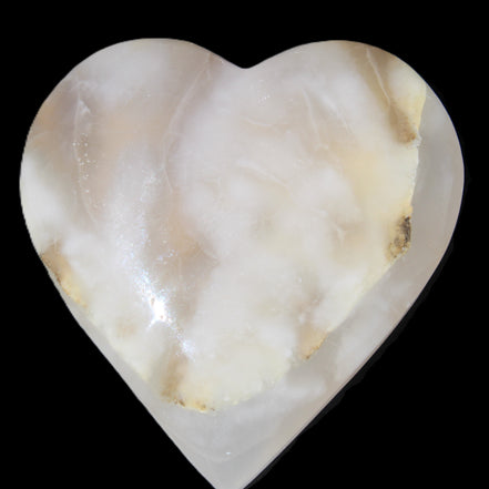 Mangano Calcite hand-carved heart 73*78*20mm 160g in sunlight - Rocks and Things Store
