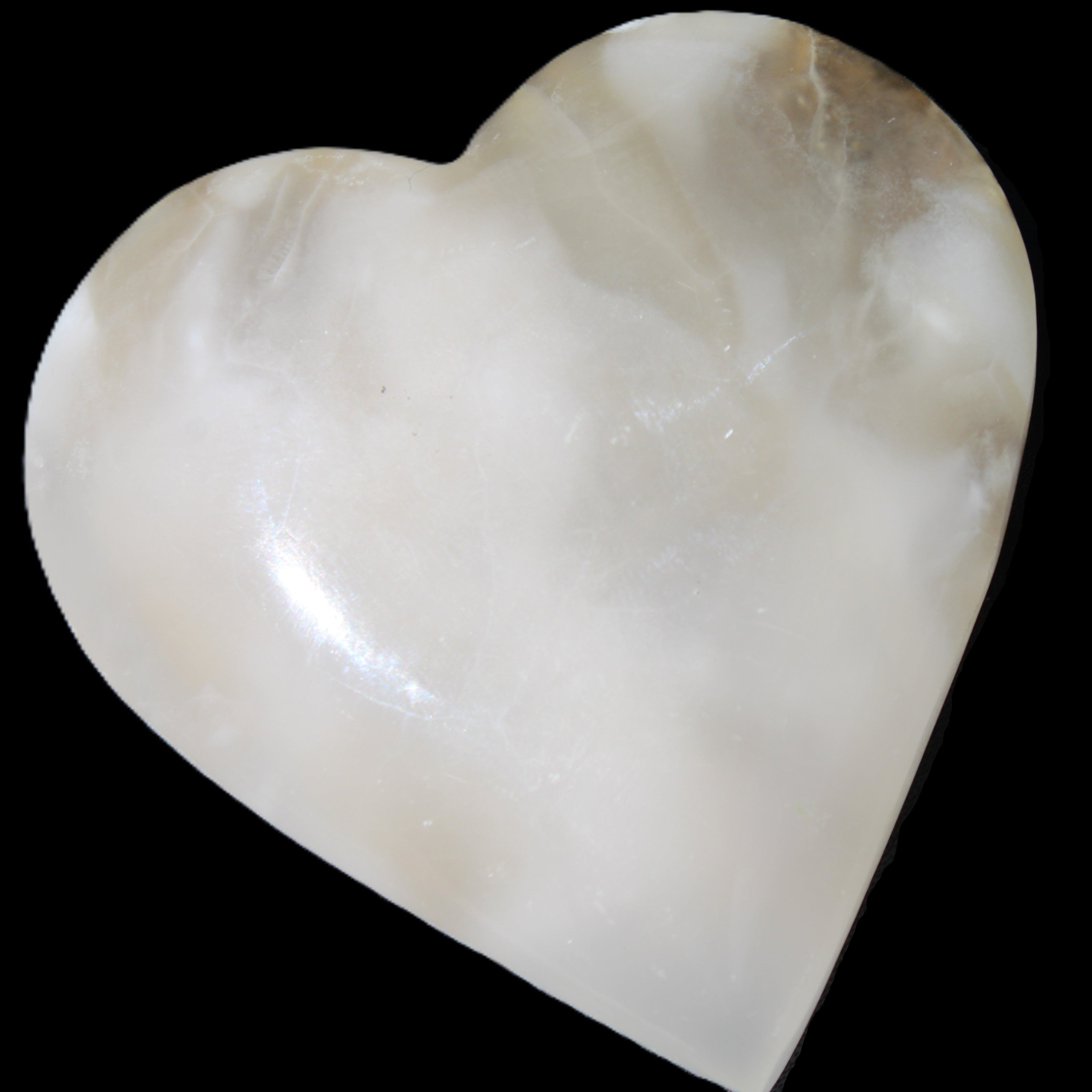 Mangano Calcite hand-carved heart 73*78*20mm 160g in sunlight - Rocks and Things Store