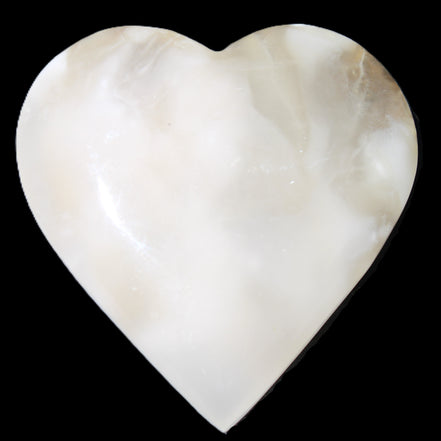 Mangano Calcite hand-carved heart 73*78*20mm 160g in sunlight - Rocks and Things Store