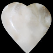 Mangano Calcite hand-carved heart 73*78*20mm 160g in sunlight - Rocks and Things Store