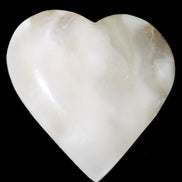 Mangano Calcite hand-carved heart 73*78*20mm 160g in sunlight - Rocks and Things Store