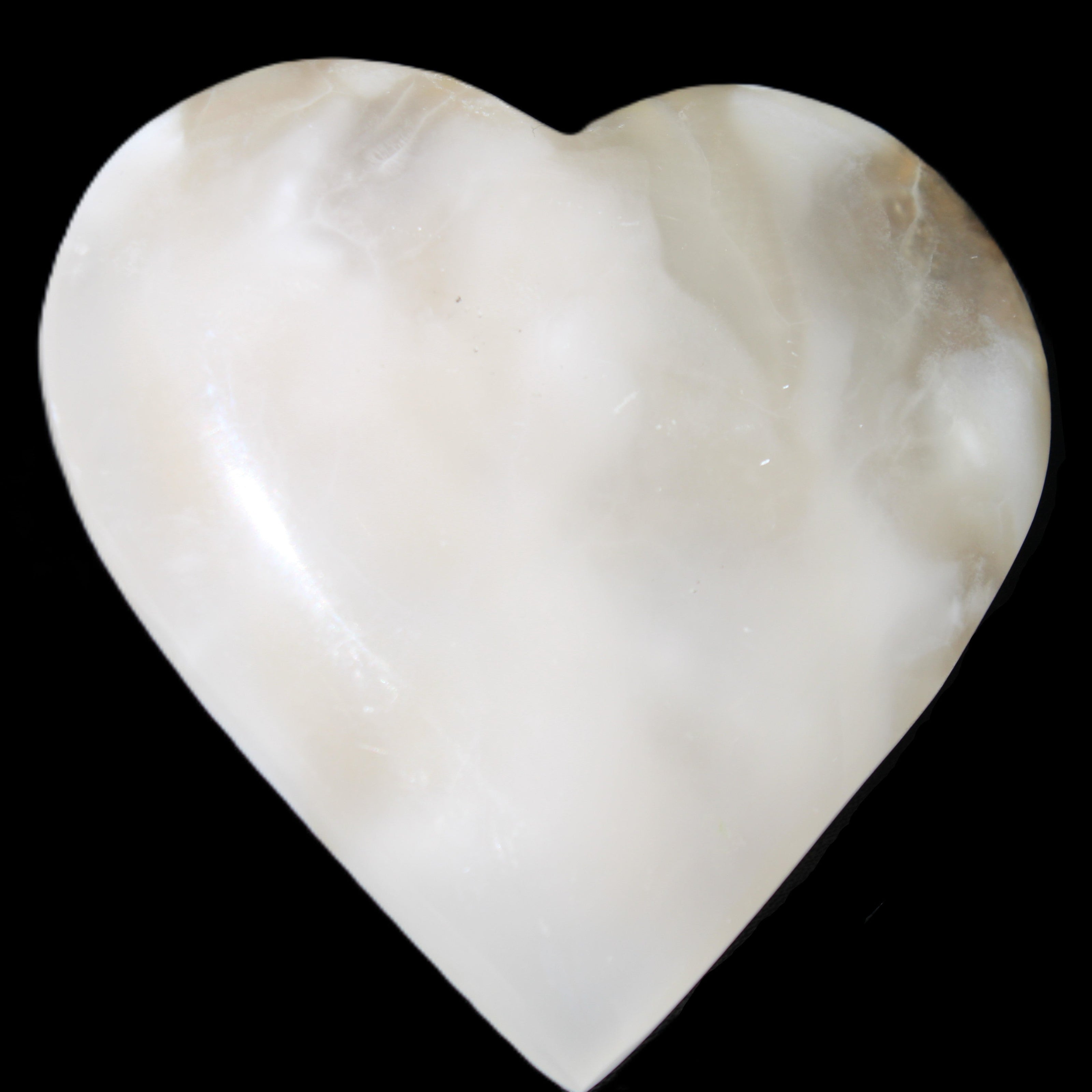 Mangano Calcite hand-carved heart 73*78*20mm 160g in sunlight - Rocks and Things Store