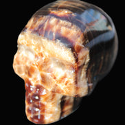 Chocolate Calcite skull 52-53mm 191-204g in sunshine - Rocks and Things Store