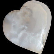 Mangano Calcite hand-carved heart 67-94mm  129-274g in sunlight - Rocks and Things Store