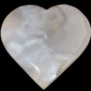 Mangano Calcite hand-carved heart 67-94mm  129-274g in sunlight - Rocks and Things Store