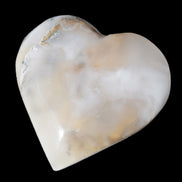 Mangano Calcite hand-carved heart 67mm  120/125g  in sunlight - Rocks and Things Store