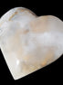 Mangano Calcite hand-carved heart 67mm  120/125g  in sunlight - Rocks and Things Store