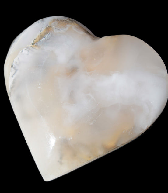 Mangano Calcite hand-carved heart 67mm  120/125g  in sunlight - Rocks and Things Store