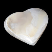 Mangano Calcite hand-carved heart 67mm  120/125g  in sunlight - Rocks and Things Store