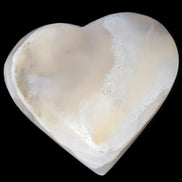 Mangano Calcite hand-carved heart 67mm  120/125g  in sunlight - Rocks and Things Store