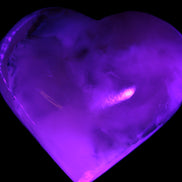 Mangano Calcite hand-carved heart 67mm  120/125g  in UV light - Rocks and Things Store