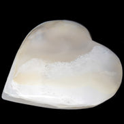 Mangano Calcite hand-carved heart 67mm 120/125g in sunlight - Rocks and Things Store