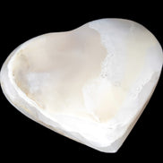 Mangano Calcite hand-carved heart 67mm 120/125g in sunlight - Rocks and Things Store