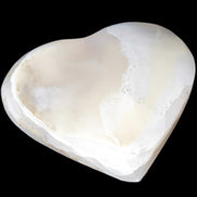 Mangano Calcite hand-carved heart 67mm 120/125g in sunlight - Rocks and Things Store