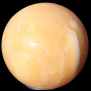 Yellow  Calcite sphere 64/65mm 346-371g  in sunshine - Rocks and Things Stores
