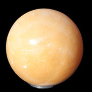 Yellow  Calcite sphere 64/65mm 346-371g  in sunshine - Rocks and Things Store