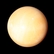 Honey Calcite sphere 53mm 187g in sunlight - Rocks and Things Store