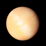 Honey Calcite sphere 53mm 187g in sunlight - Rocks and Things Store