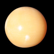 Honey Calcite sphere 53mm 187g in sunlight - Rocks and Things Store