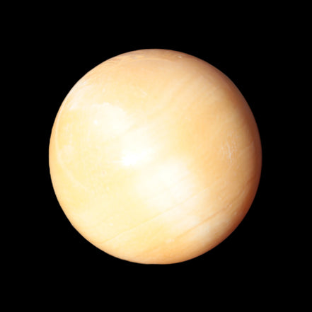Honey Calcite sphere 53mm 187g in sunlight - Rocks and Things Store