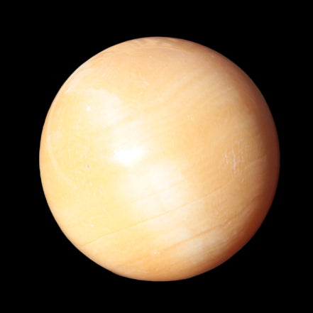 Honey Calcite sphere 53mm 187g in sunlight - Rocks and Things Store