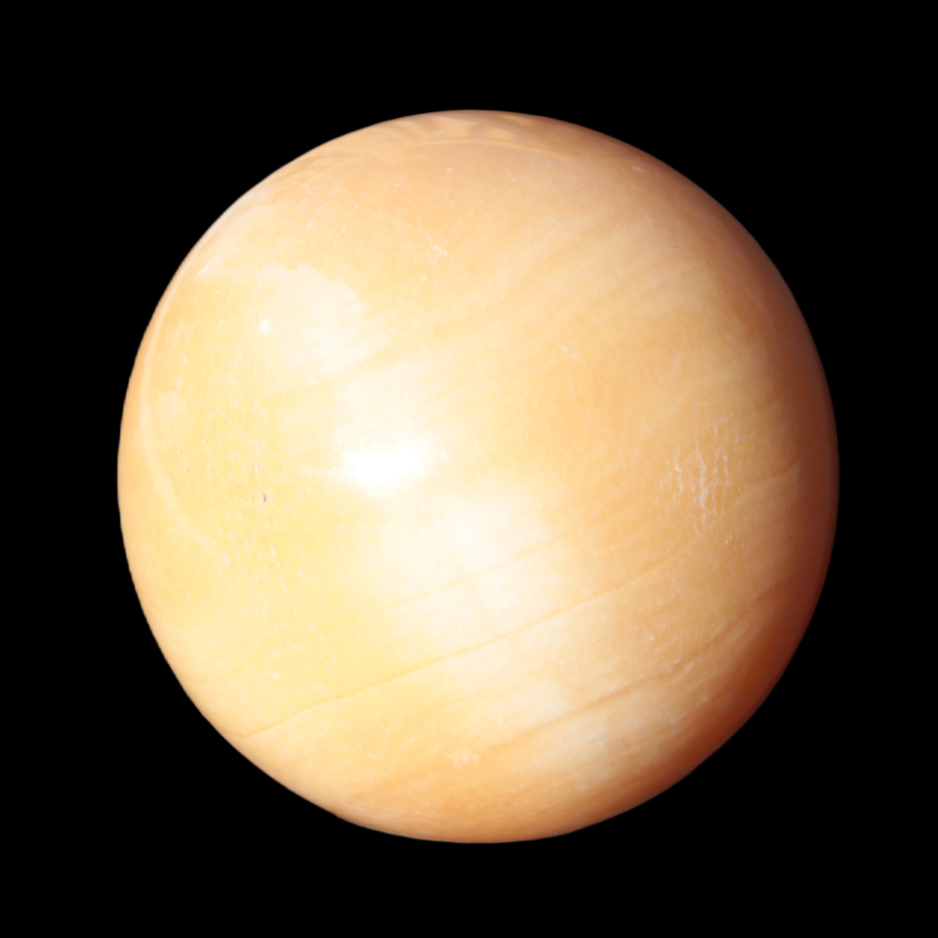 Honey Calcite sphere 53mm 187g in sunlight - Rocks and Things Store