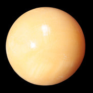 Honey Calcite sphere 53mm 187g in sunlight - Rocks and Things Store