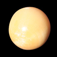 Honey Calcite sphere 53mm 187g in sunlight - Rocks and Things Store