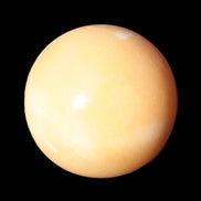 Honey Calcite sphere 53mm 187g in sunlight - Rocks and Things Store
