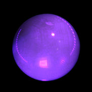 Honey Calcite sphere 53mm 187g in UV light - Rocks and Things Store