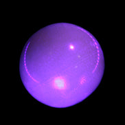 Honey Calcite sphere 53mm 187g in UV light - Rocks and Things Store