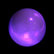Honey Calcite sphere 53mm 187g in UV light - Rocks and Things Store