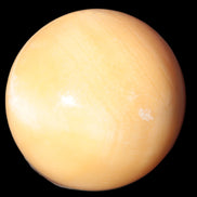 Honey Calcite sphere 53mm 187g in sunlight - Rocks and Things Store