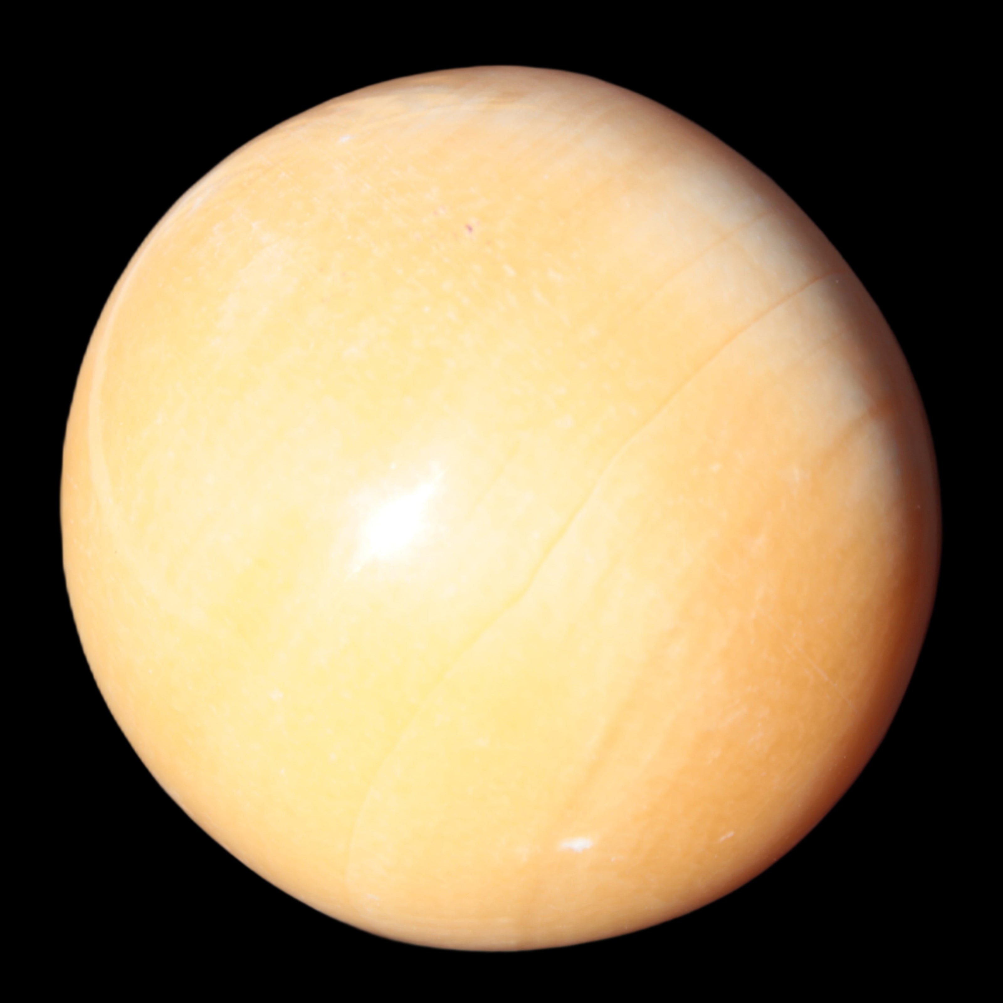Honey Calcite sphere 53mm 187g in UV light - Rocks and Things Store