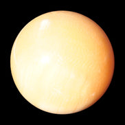 Honey Calcite sphere 53mm 187g in sunlight - Rocks and Things Store