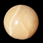 Topaz Honey Calcite sphere 63mm 341g in sunlight - Rocks and Things Store
