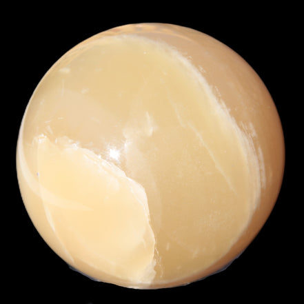 Topaz Honey Calcite sphere 63mm 341g in sunlight - Rocks and Things Store