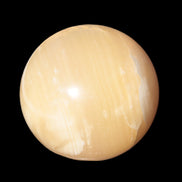 Topaz Honey Calcite sphere 63mm 341g in sunlight - Rocks and Things Store