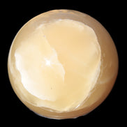 Topaz Honey Calcite sphere 63mm 341g in sunlight - Rocks and Things Store