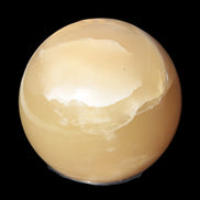 Topaz Honey Calcite sphere 63mm 341g in sunlight - Rocks and Things Store