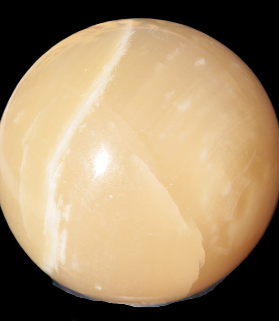 Topaz Honey Calcite sphere 63mm 341g in sunlight - Rocks and Things Store