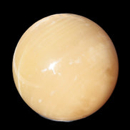 Topaz Honey Calcite sphere 63mm 341g in sunlight - Rocks and Things Store