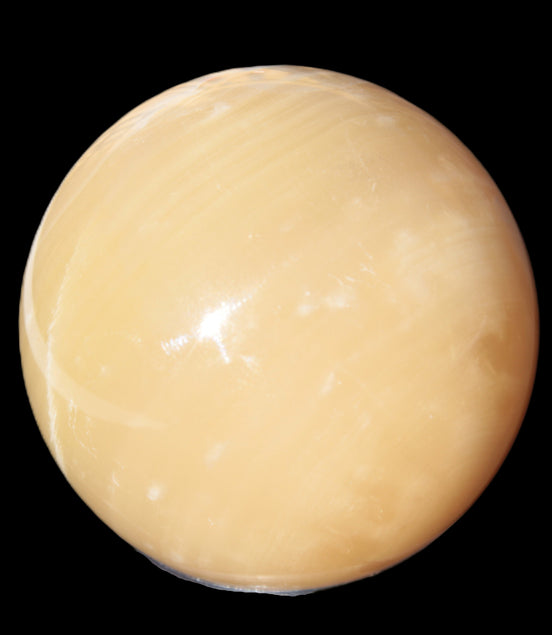 Topaz Honey Calcite sphere 63mm 341g in sunlight - Rocks and Things Store