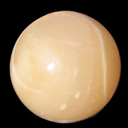 Topaz Honey Calcite sphere 63mm 341g in sunlight - Rocks and Things Store
