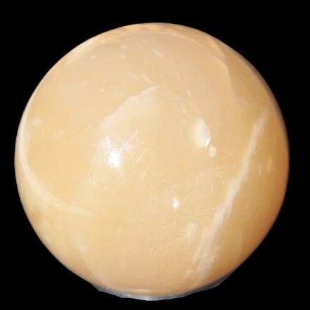 Topaz Honey Calcite sphere 63mm 341g in sunlight - Rocks and Things Store