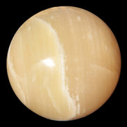 Topaz Honey Calcite sphere 63mm 341g in sunlight - Rocks and Things Store